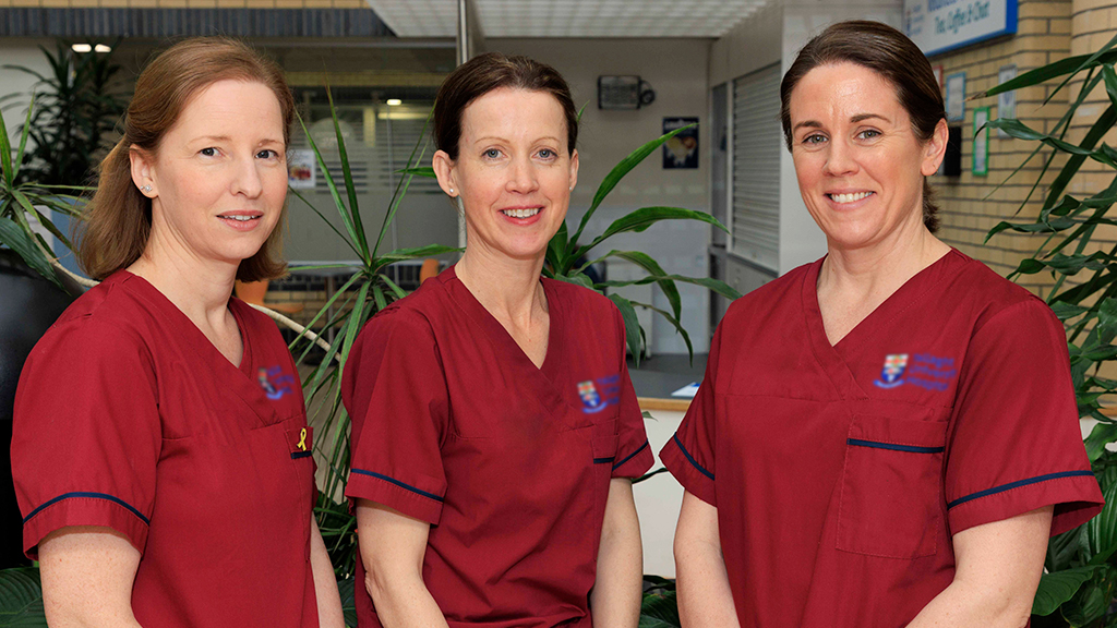 Three Endo nurses from Tallaght University Hospital in uniform inside smiling at camera